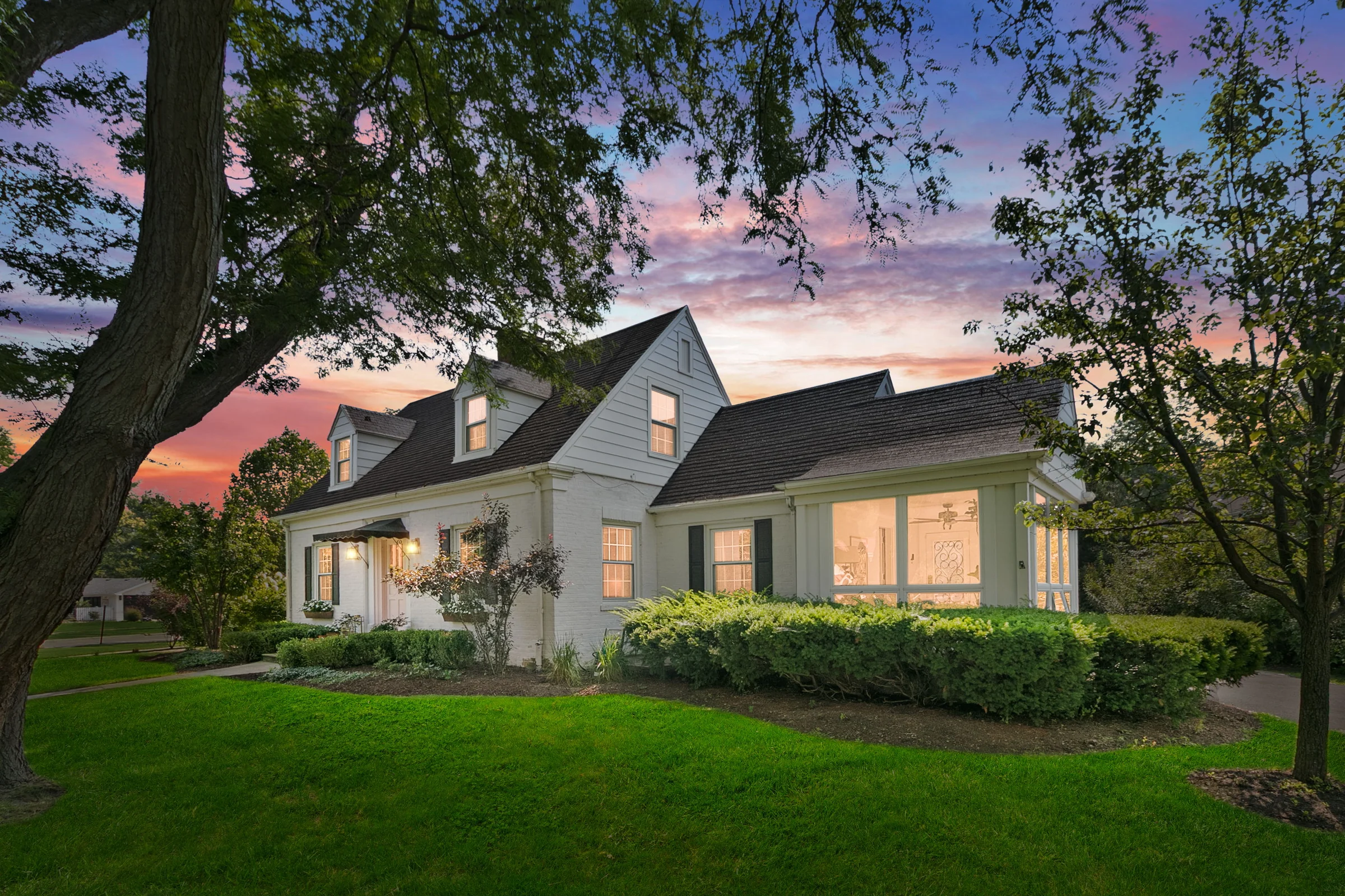 Home and landscaped lawn at twilight