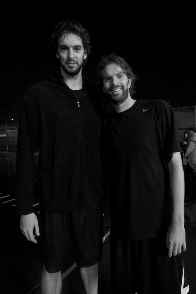 Michael standing with an NBA player during a commercial production in Los Angeles